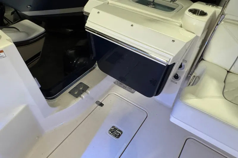 Slide: The Image of 2026 Pursuit DC 326 Dual Console interior with seating and storage compartments. - 10