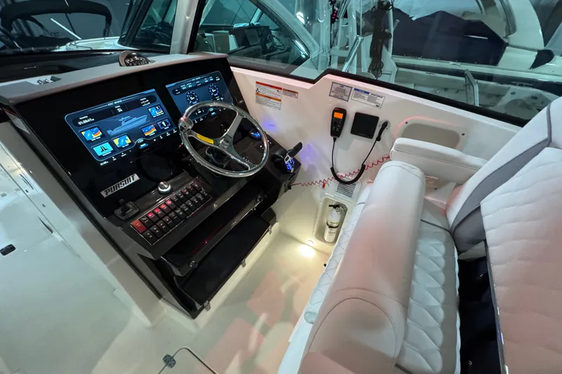 Slide: The Image of 2026 Pursuit DC 326 Dual Console cockpit with modern controls and plush seating. - 22