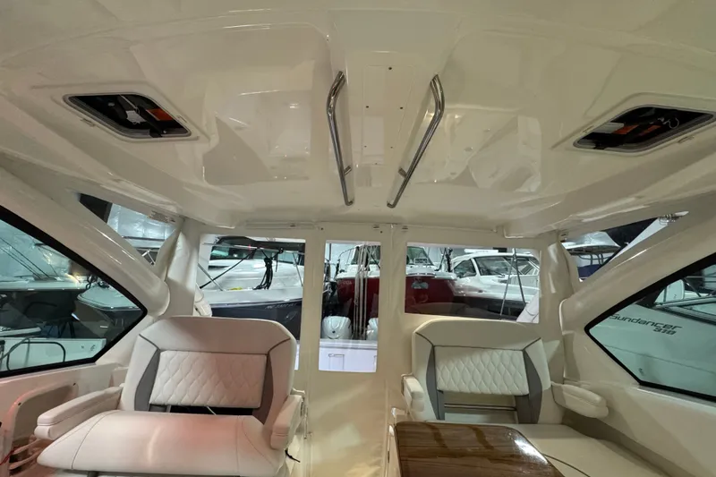 Slide: The Image of Interior of 2026 Pursuit DC 326 Dual Console boat, featuring luxurious seating and modern design. - 20
