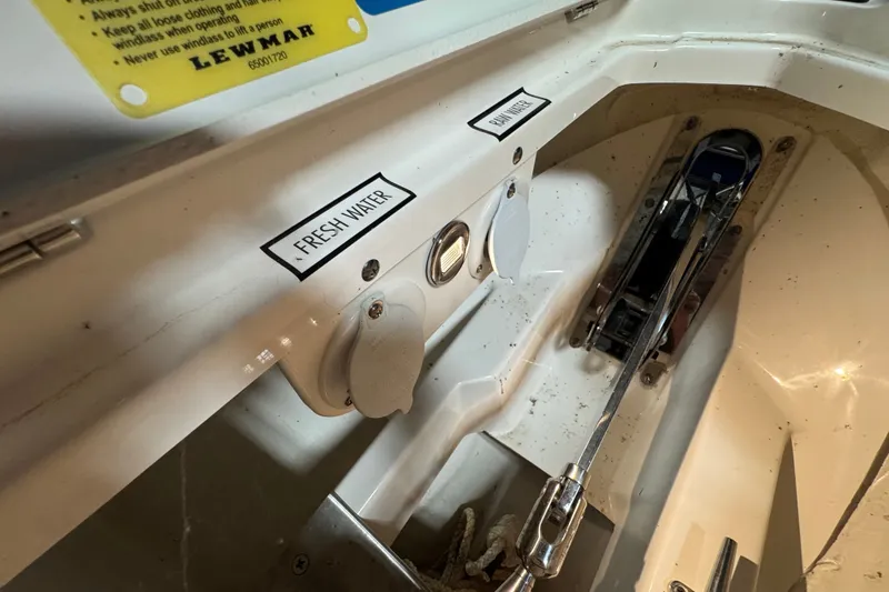Slide: The Image of 2026 Pursuit DC 326 Dual Console boat interior with fresh water and raw water access. - 35