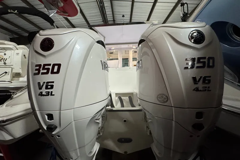 Slide: The Image of Twin Yamaha 350 V6 outboard engines on a 2026 Pursuit DC 326 Dual Console boat. - 5