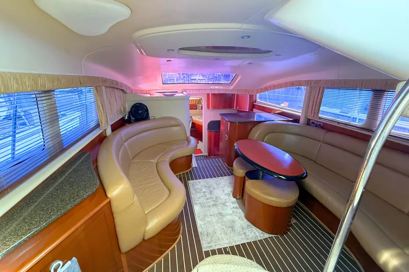 Slide: The Image of Luxurious interior of 2005 Sea Ray 390 Motor Yacht with plush seating and elegant design. - 16
