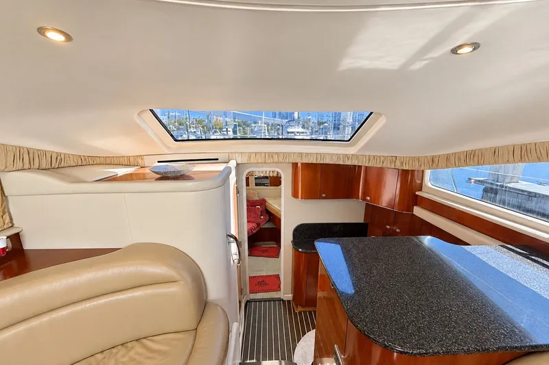 Slide: The Image of Luxurious interior of a 2005 Sea Ray 390 Motor Yacht with elegant wood finishes. - 19