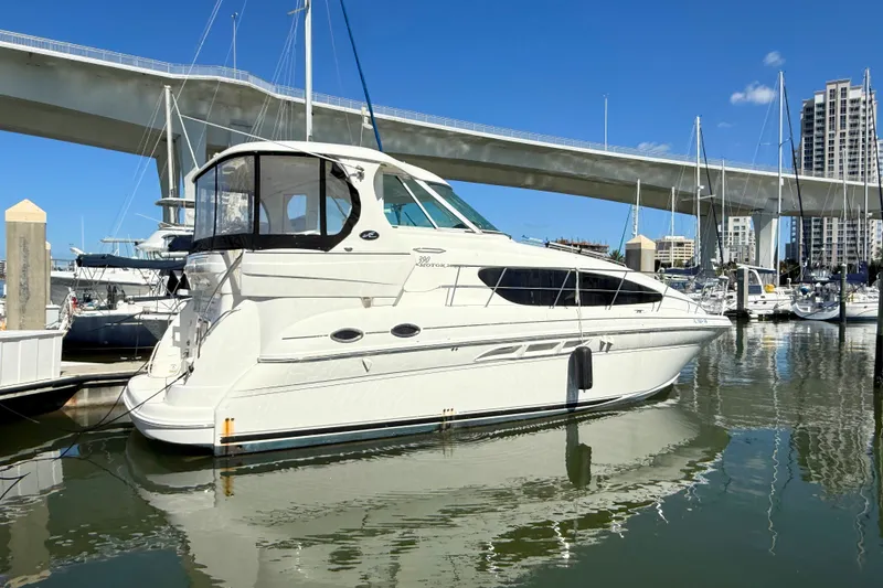 Slide: The Image of 2005 Sea Ray 390 Motor Yacht docked in marina under clear blue sky. - 5