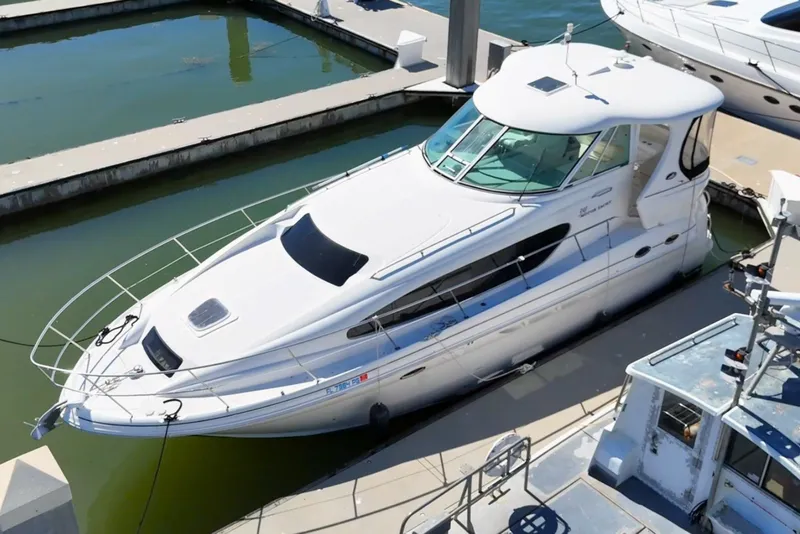 Slide: The Image of 2005 Sea Ray 390 Motor Yacht docked at marina, aerial view. - 2