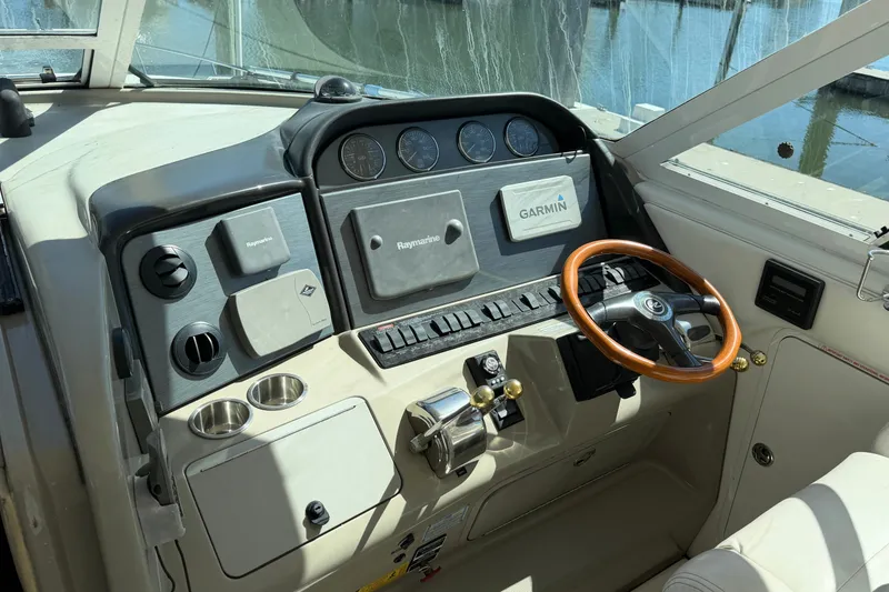 Slide: The Image of 2005 Sea Ray 390 Motor Yacht helm with Garmin and Raymarine navigation systems. - 13
