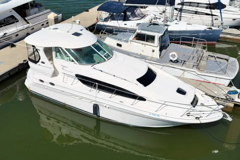 Slide: The Image of 2005 Sea Ray 390 Motor Yacht docked at marina, aerial view. - 0