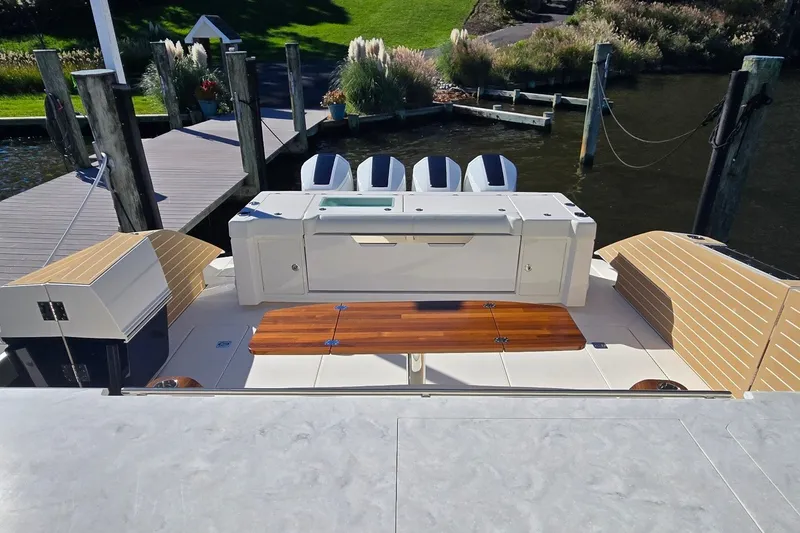 Slide: The Image of 2026 Tiara Yachts 56 LS luxury boat docked, featuring sleek design and modern amenities. - 22