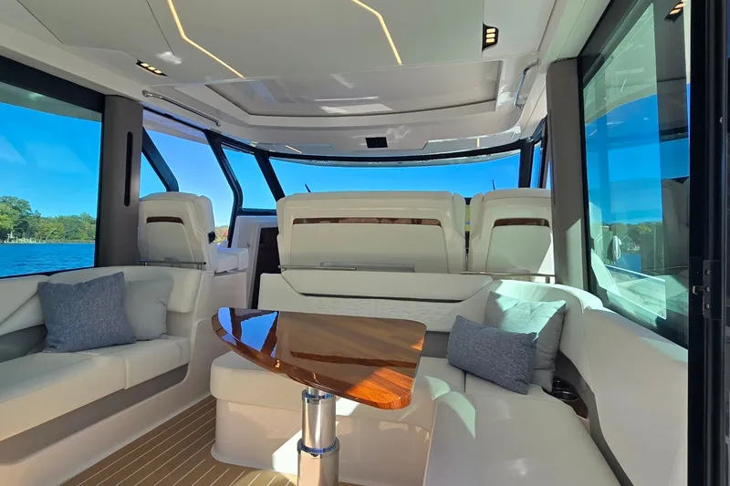Slide: The Image of Luxurious interior of 2026 Tiara Yachts 56 LS with elegant seating and panoramic windows. - 44