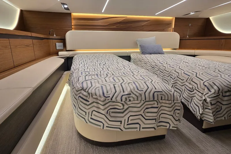 Slide: The Image of Luxurious 2026 Tiara Yachts 56 LS cabin with twin beds and modern decor. - 64