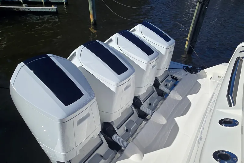 Slide: The Image of Four powerful outboard engines on a 2026 Tiara Yachts 56 LS boat. - 83