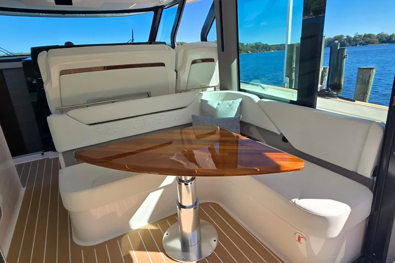 Slide: The Image of Luxurious interior of 2026 Tiara Yachts 56 LS with elegant seating and wooden table. - 45
