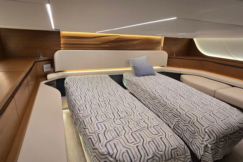 Slide: The Image of Luxurious 2026 Tiara Yachts 56 LS cabin with twin beds and modern design. - 73