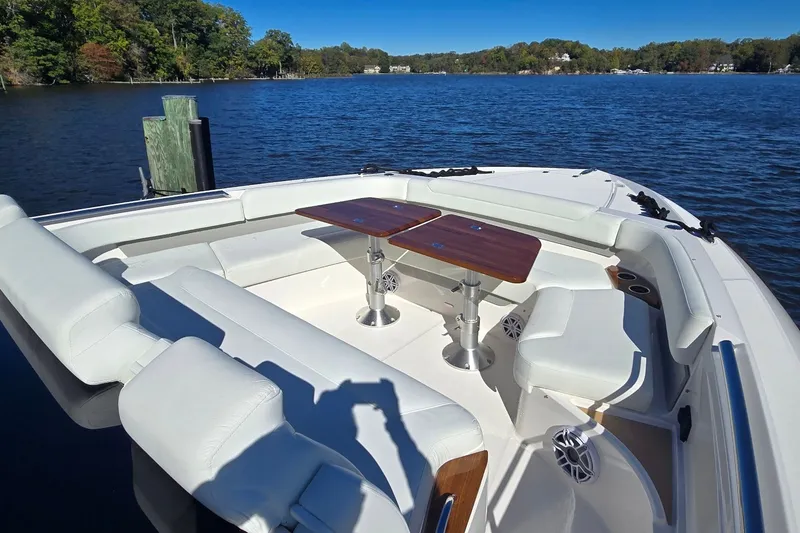 Slide: The Image of Luxurious seating area on 2026 Tiara Yachts 56 LS, overlooking serene waters. - 34