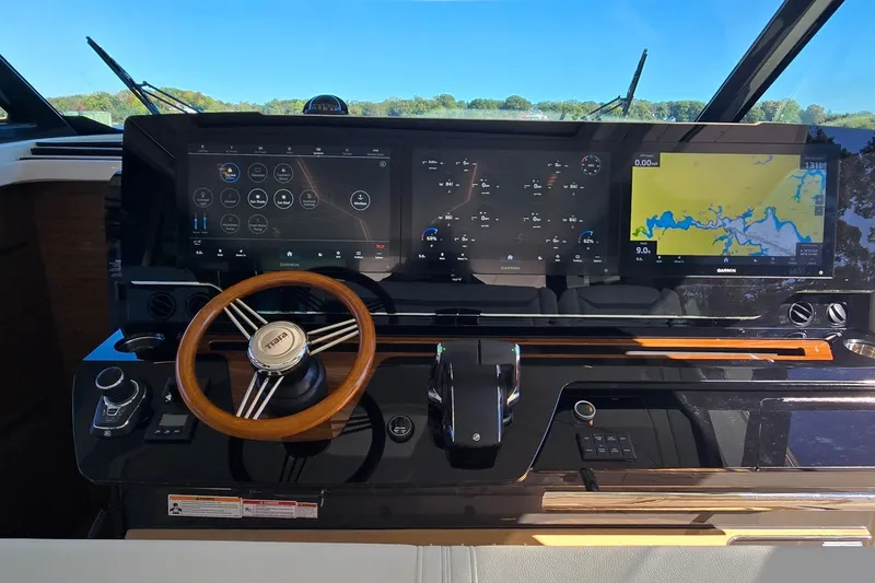 Slide: The Image of Helm of 2026 Tiara Yachts 56 LS with advanced navigation displays and controls. - 52