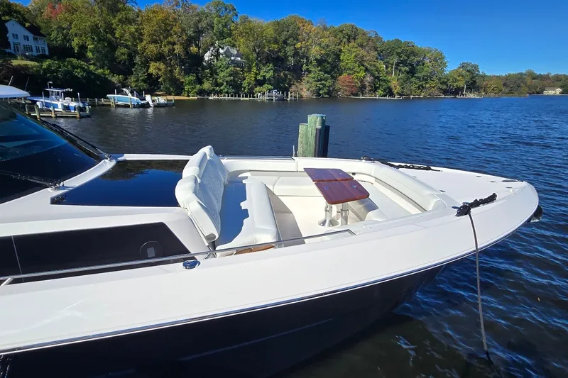 Slide: The Image of 2026 Tiara Yachts 56 LS luxury boat docked on a serene lake. - 26