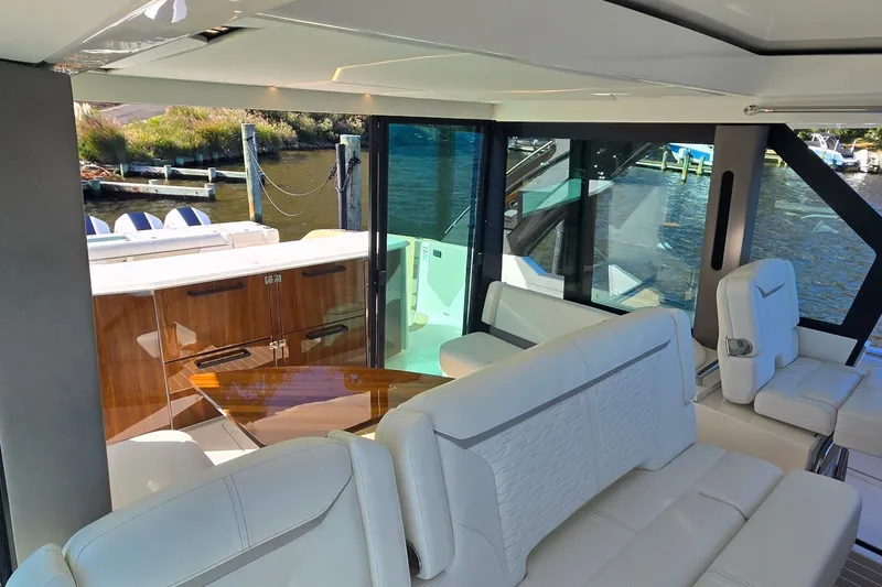 Slide: The Image of Luxurious interior of 2026 Tiara Yachts 56 LS with elegant seating and waterfront view. - 46
