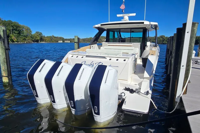 Slide: The Image of 2026 Tiara Yachts 56 LS docked, featuring four powerful outboard engines. - 7