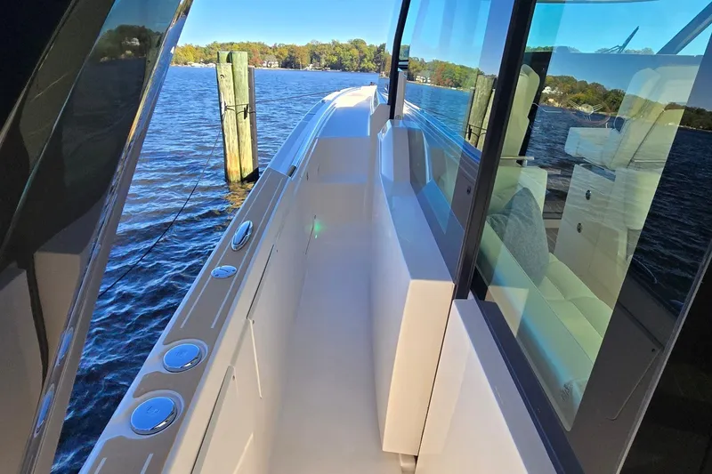 Slide: The Image of 2026 Tiara Yachts 56 LS docked, showcasing sleek design and waterfront view. - 37