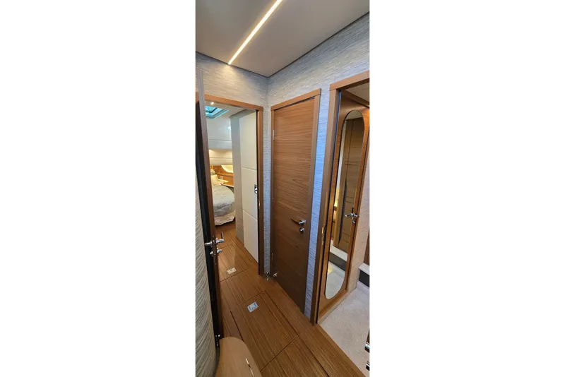 Slide: The Image of Luxurious interior of 2026 Tiara Yachts 56 LS, featuring elegant wood finishes and modern design. - 54