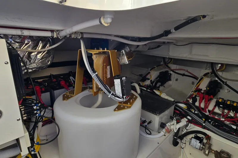 Slide: The Image of Engine room of 2026 Tiara Yachts 56 LS, showcasing wiring and mechanical components. - 82