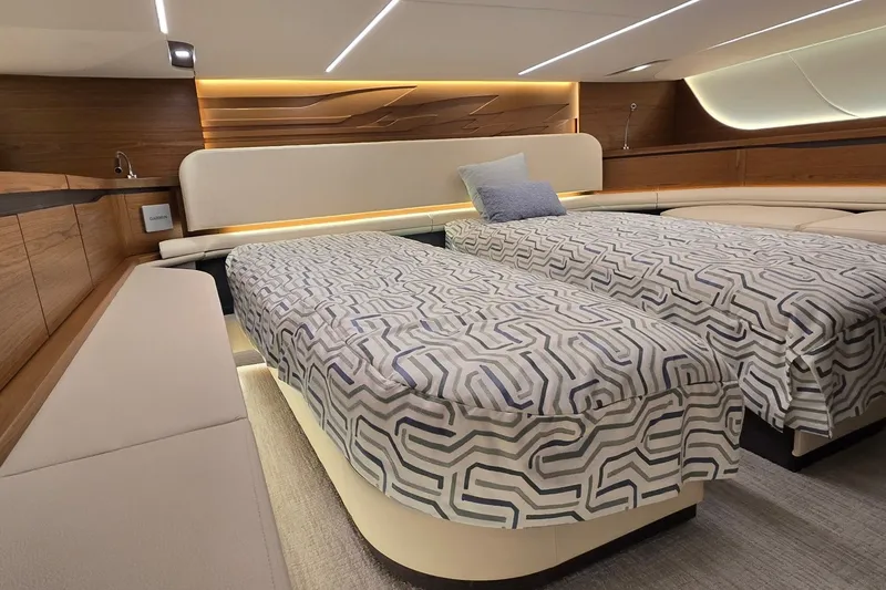 Slide: The Image of Luxurious cabin interior of 2026 Tiara Yachts 56 LS with twin beds and modern design. - 63