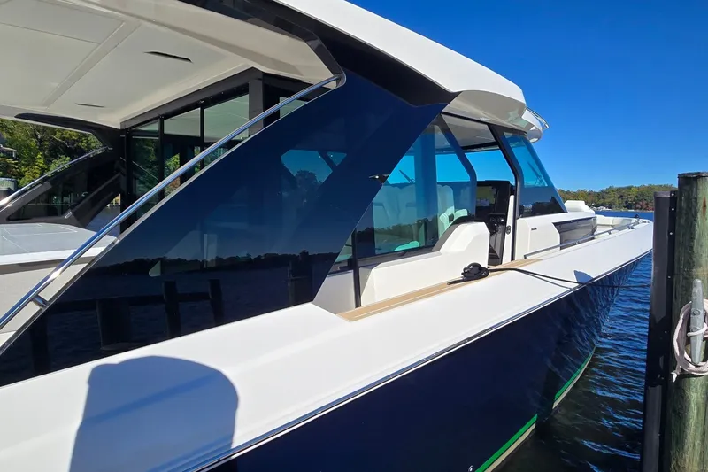 Slide: The Image of 2026 Tiara Yachts 56 LS luxury yacht docked, showcasing sleek design and modern features. - 24