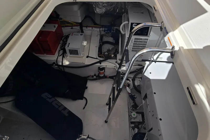 Slide: The Image of Engine compartment of 2026 Tiara Yachts 56 LS, showcasing mechanical components and equipment. - 78