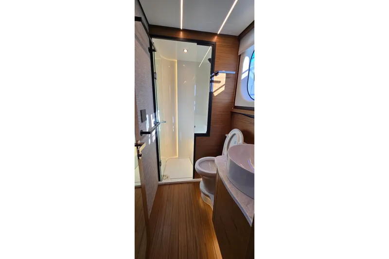 Slide: The Image of Luxurious bathroom interior of 2026 Tiara Yachts 56 LS, featuring modern fixtures and elegant design. - 74