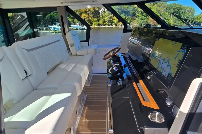 Slide: The Image of Luxurious interior of 2026 Tiara Yachts 56 LS with plush seating and advanced navigation system. - 49
