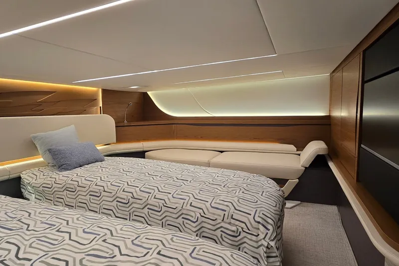 Slide: The Image of Luxurious interior of 2026 Tiara Yachts 56 LS with modern bedding and ambient lighting. - 65