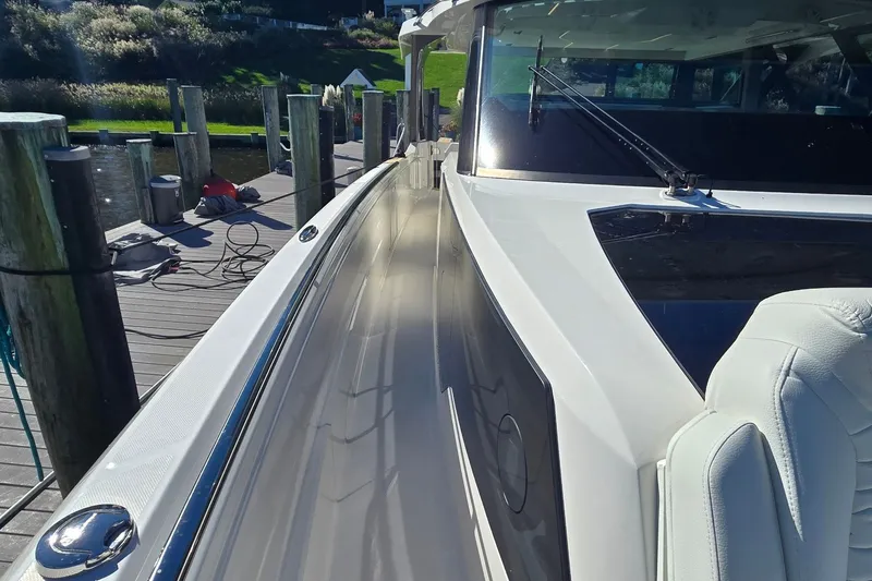 Slide: The Image of 2026 Tiara Yachts 56 LS docked, showcasing sleek design and luxurious seating. - 38