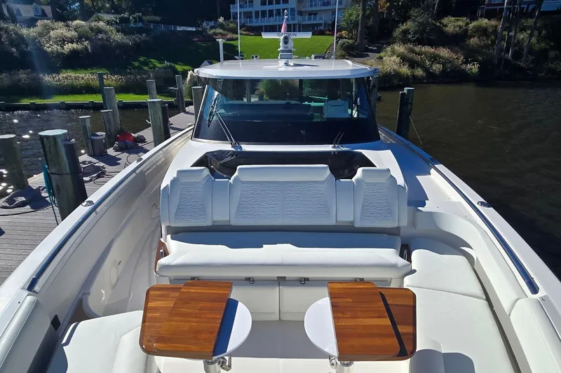 Slide: The Image of 2026 Tiara Yachts 56 LS luxury yacht with elegant seating and wooden tables. - 28