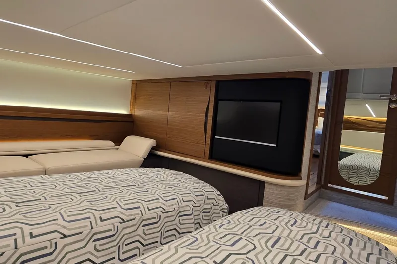 Slide: The Image of Luxurious cabin interior of 2026 Tiara Yachts 56 LS with modern design and comfortable bedding. - 66