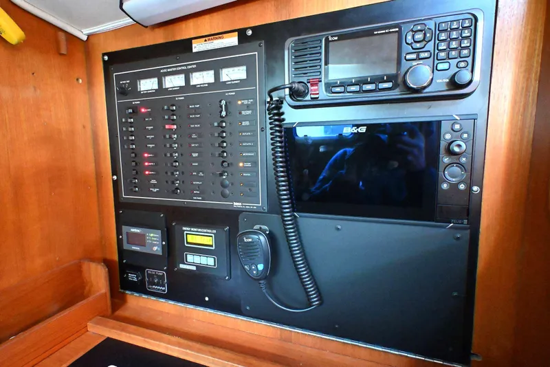 Slide: The Image of Control panel of a 2001 Caliber 40 LRC yacht with navigation and communication equipment. - 51