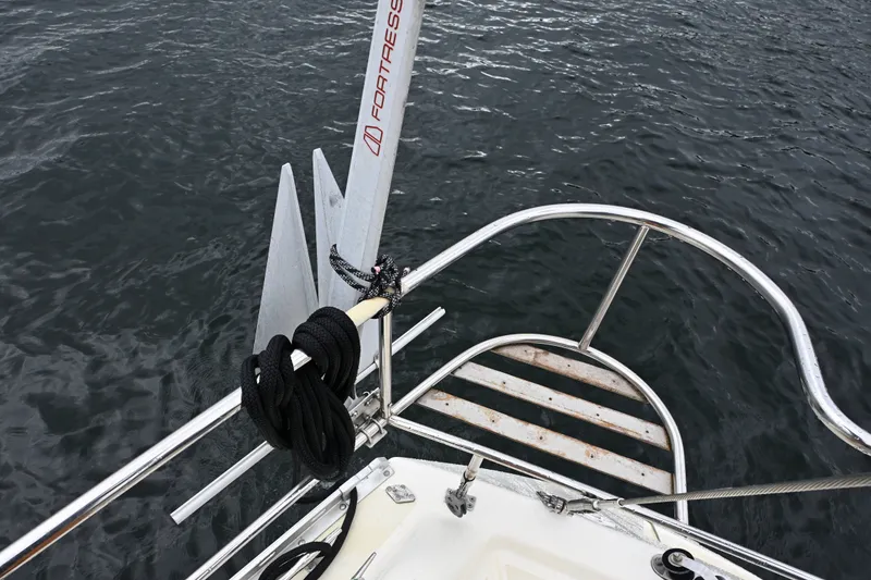 Slide: The Image of Bow of 2001 Caliber 40 LRC sailboat with anchor and coiled rope. - 42