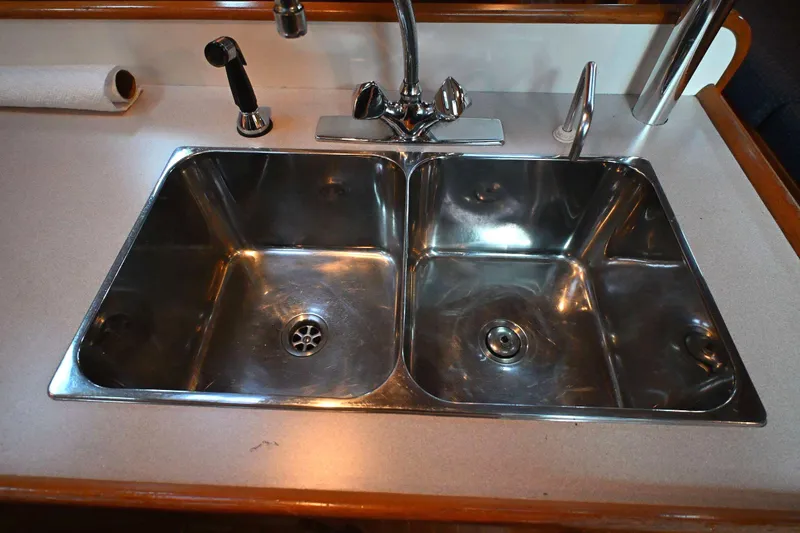 Slide: The Image of Stainless steel double sink on a 2001 Caliber 40 LRC yacht kitchen counter. - 49