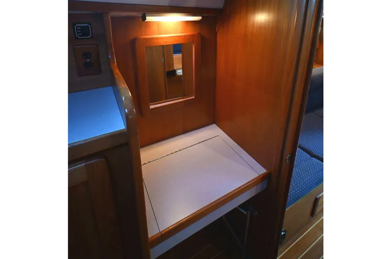 Slide: The Image of Wooden interior of 2001 Caliber 40 LRC yacht with built-in desk and mirror. - 52