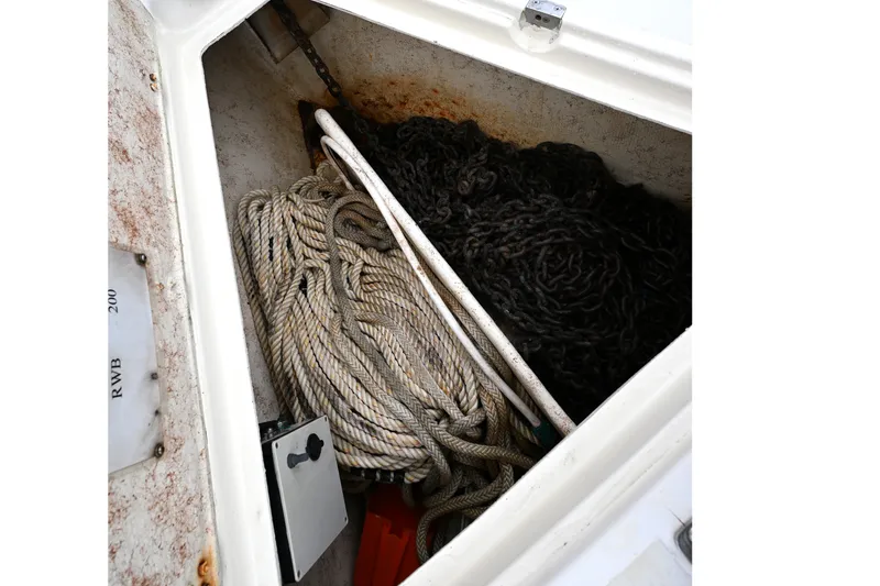 Slide: The Image of Anchor locker of 2001 Caliber 40 LRC with ropes and chains. - 16