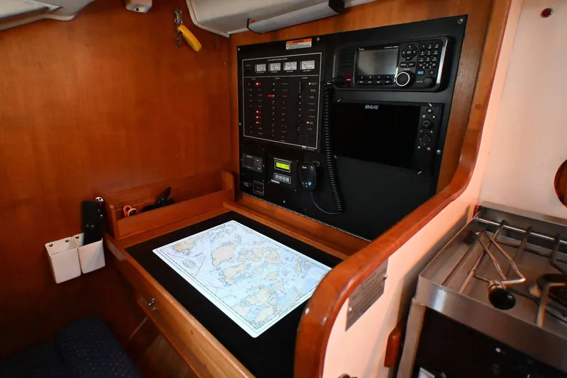 Slide: The Image of Navigation station inside 2001 Caliber 40 LRC yacht with map and communication equipment. - 50