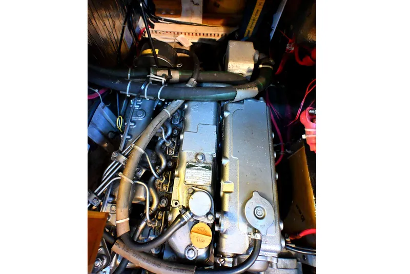 Slide: The Image of Engine compartment of a 2001 Caliber 40 LRC sailboat, showing detailed mechanical components. - 71