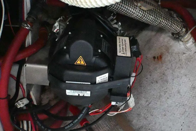 Slide: The Image of Engine compartment of a 2001 Caliber 40 LRC with visible wiring and components. - 81