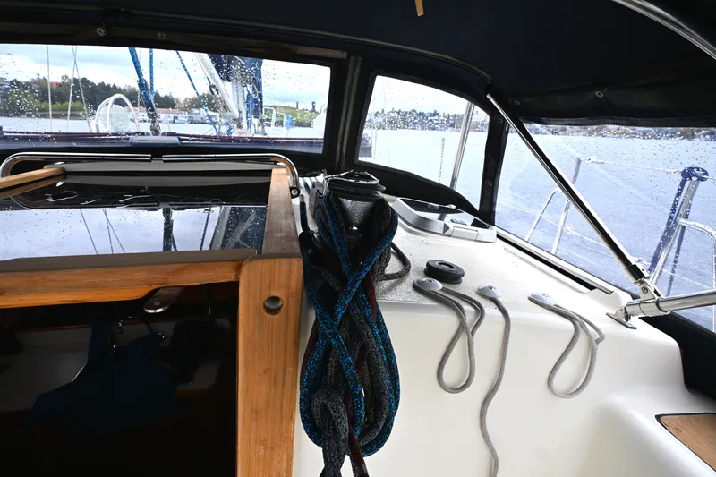 Slide: The Image of Interior view of a 2001 Caliber 40 LRC sailboat cockpit with ropes and equipment. - 6