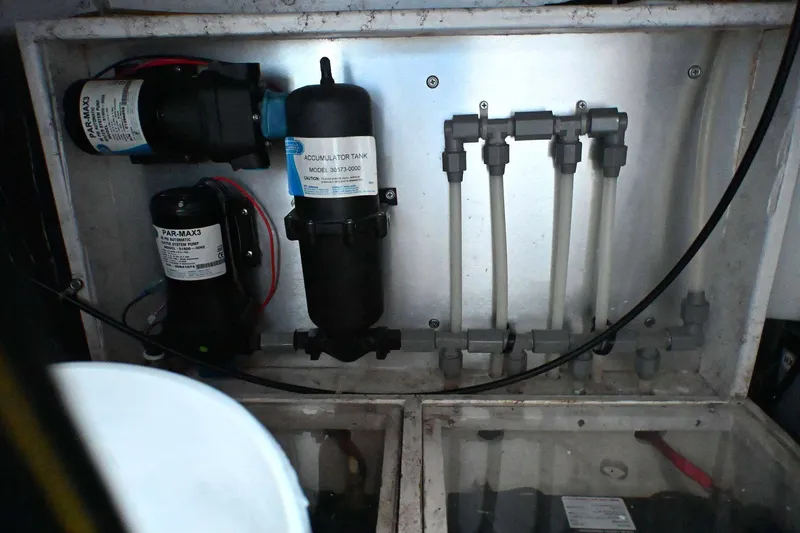 Slide: The Image of Boat plumbing system with pumps and accumulator tank in a 2001 Caliber 40 LRC. - 78
