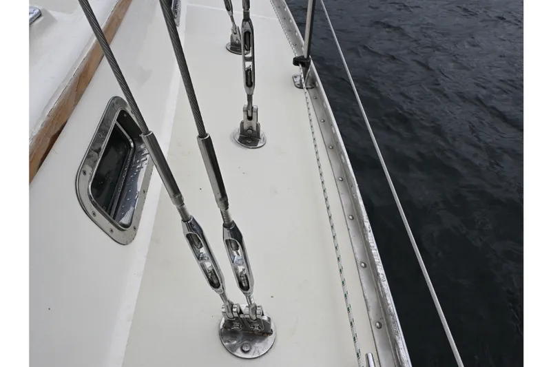 Slide: The Image of Deck view of 2001 Caliber 40 LRC sailboat with rigging and ocean background. - 11