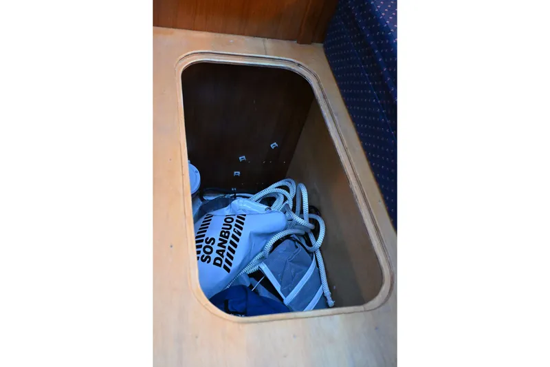 Slide: The Image of Storage compartment in 2001 Caliber 40 LRC yacht with SOS Danbuoy and rope. - 68