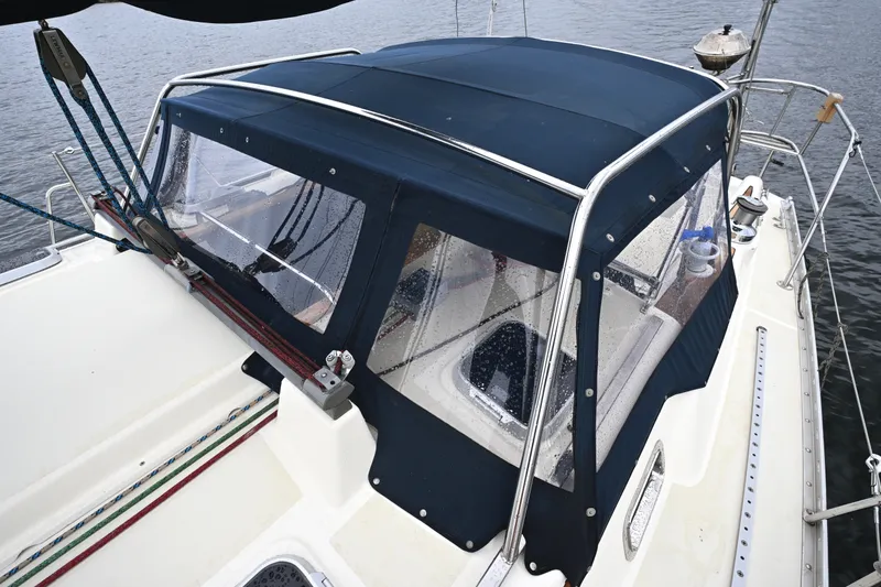 Slide: The Image of 2001 Caliber 40 LRC sailboat with blue canvas cover on deck. - 8