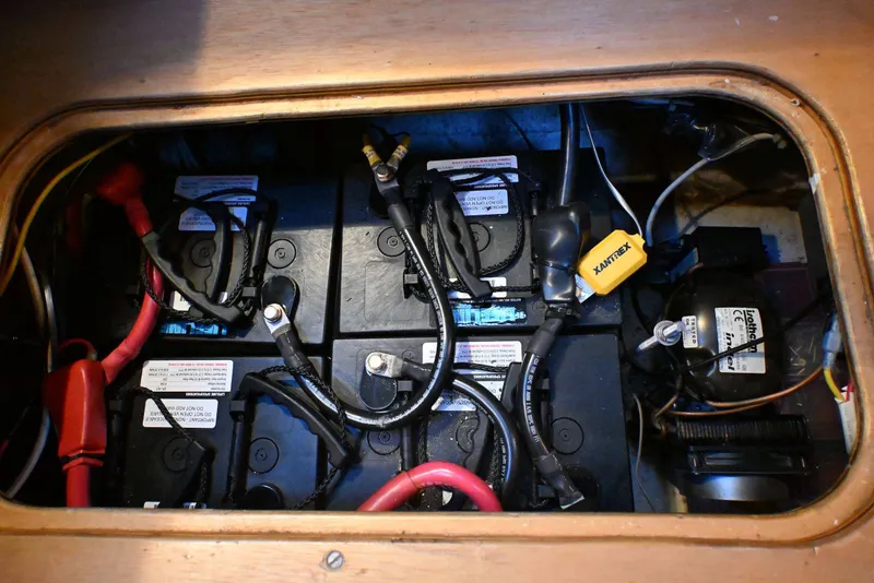 Slide: The Image of Battery compartment of a 2001 Caliber 40 LRC sailboat with wiring and connections. - 76