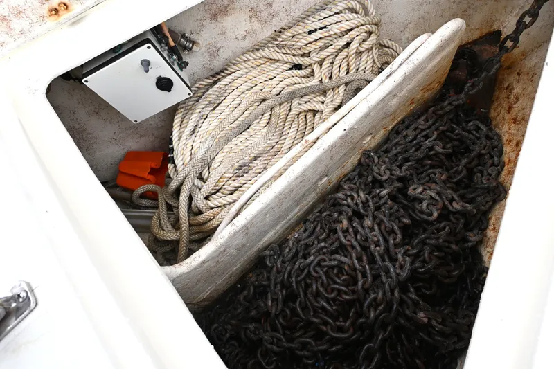 Slide: The Image of Anchor locker of 2001 Caliber 40 LRC with ropes and chains. - 17