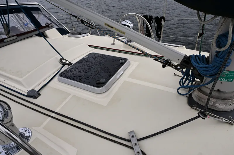 Slide: The Image of Deck of 2001 Caliber 40 LRC sailboat with ropes and hatch. - 20